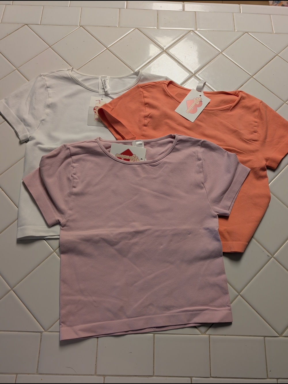 Nikibiki White, Coral, and Lavender Short Sleeve Tees